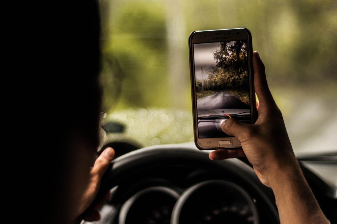 NEWS | Scrolling through your playlist whilst driving could soon see you get a £200 fine and six points on your licence