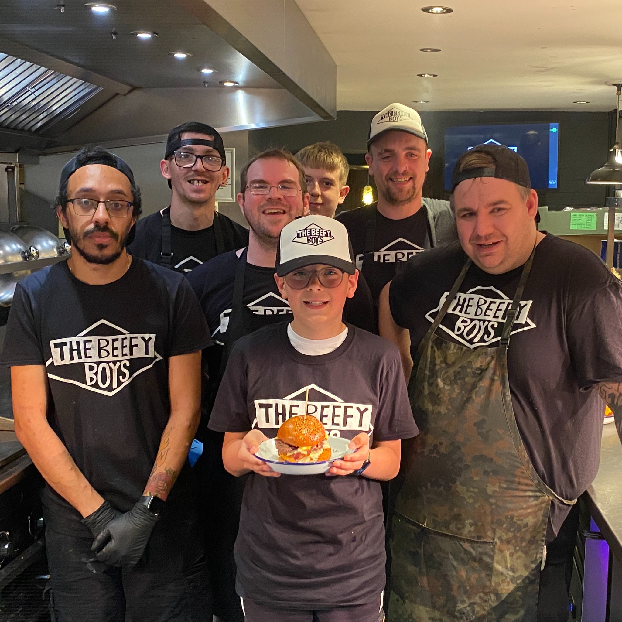 NEWS | The Beefy Boys invite young customer in to build his own burger