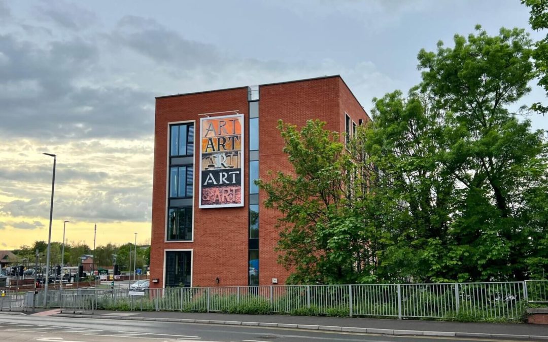 NEWS | Artists create a vibrant illuminated sign for the Hereford College of Arts halls of residence at Station Approach