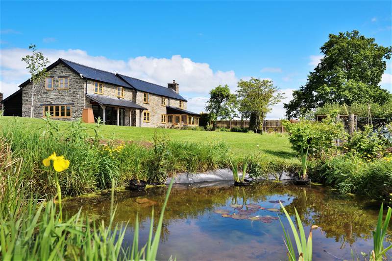 FEATURED | A stunning family home in the Herefordshire countryside that has been recently extended and has three luxury rustic cabins