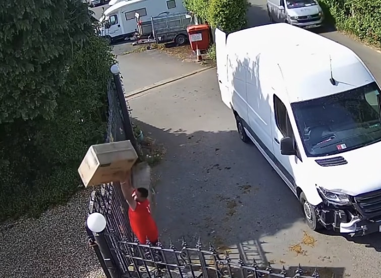 WATCH | Shocking moment delivery driver throws fragile item over gate – leaving the item damaged