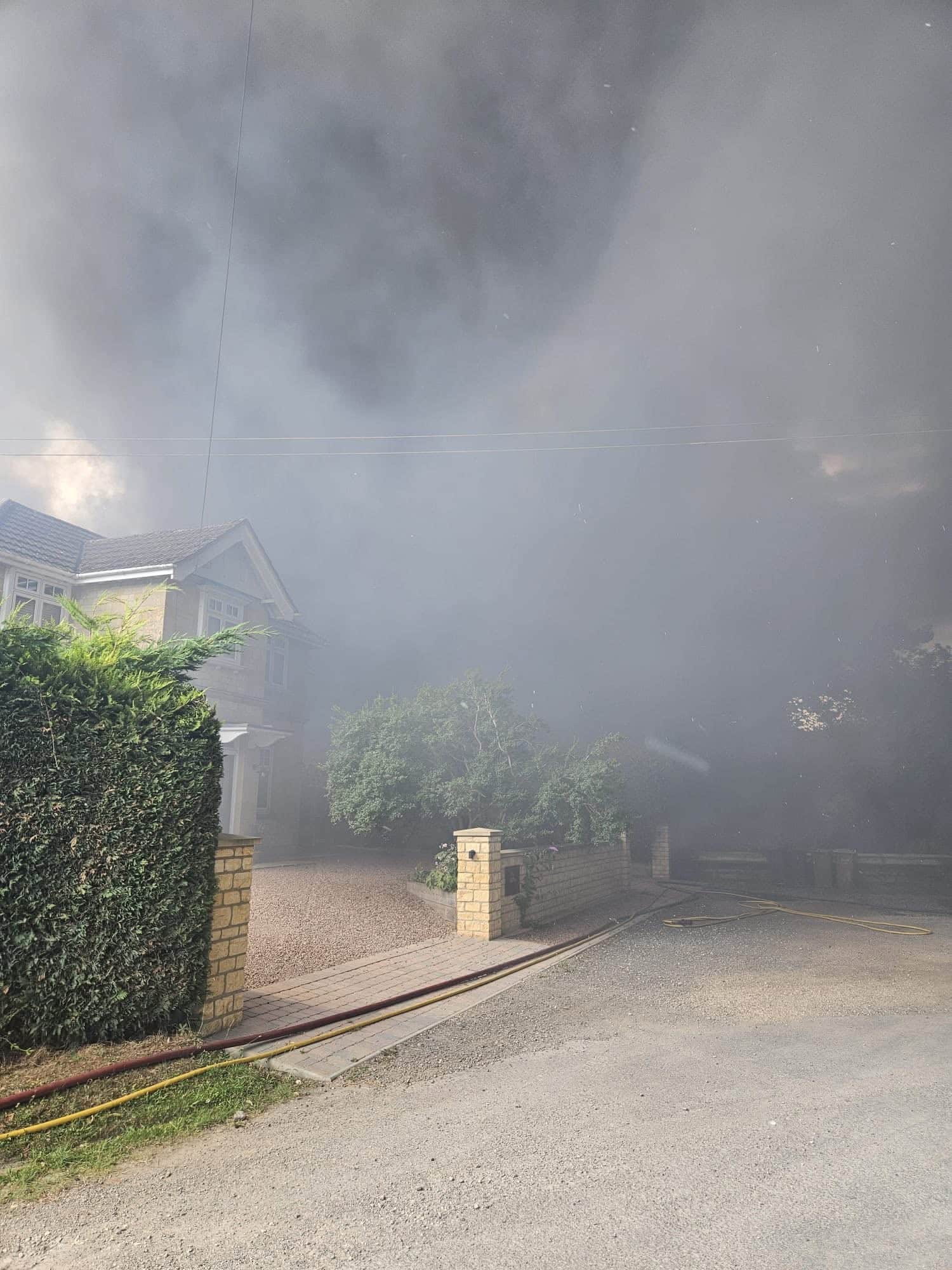BREAKING | Fire crews called to a large fire at a building near a number of houses