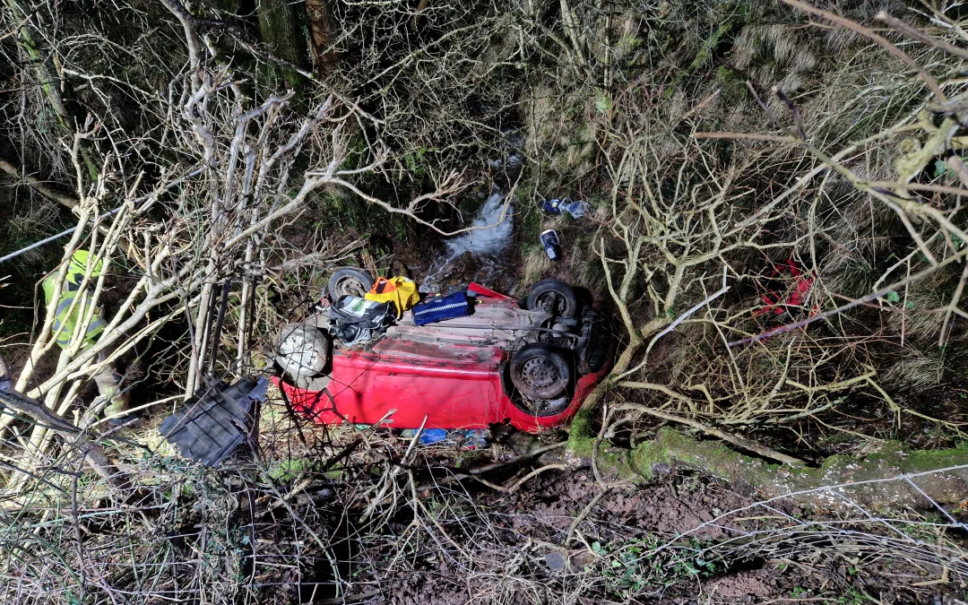 NEWS | Emergency services called after a vehicle rolled down an embankment and ended up on its roof in a stream